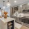 kitchen with an island, modern appliances and spacious counter-space