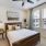 bedroom with ample space around the bed and bright lighting
