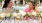 Two women enjoying a picnic together at the pool